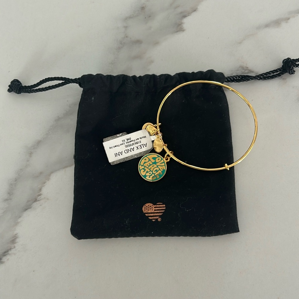 Alex & Ani Bangle Peace Charm New With Tags and Dust‎ Bag.